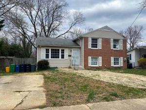 a home with a brick house with a yard at Park B&B in Oxon Hill