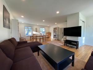 a living room with a couch and a table at Park B&B in Oxon Hill