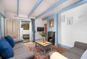 TV a/nebo společenská místnost v ubytování Saffron Cottage, St Ives