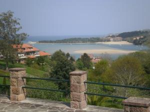 a view of a body of water from a balcony at Pensión Galimar in San Vicente de la Barquera +11 photos