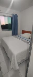 Łóżko lub łóżka w pokoju w obiekcie Pousada Serra Mares