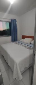 Cama ou camas em um quarto em Pousada Serra Mares