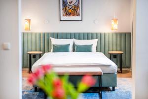 Posteľ alebo postele v izbe v ubytovaní Hotel H12****
