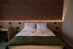 Postel nebo postele na pokoji v ubytování HOTEL GRACIAN