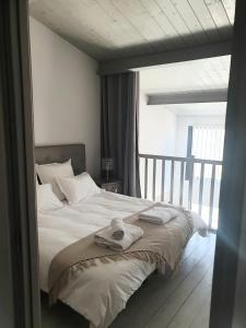 Posteľ alebo postele v izbe v ubytovaní La Villa Michèle, domaine sur les hauteurs de Pézenas