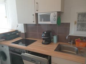 Kuchyňa alebo kuchynka v ubytovaní 3 pièces face mer et St-Tropez