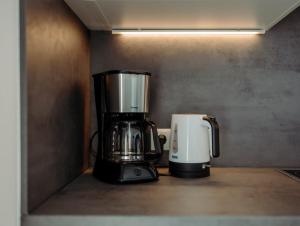 Příslušenství pro přípravu čaje a kávy v ubytování Appartement Hammerrain