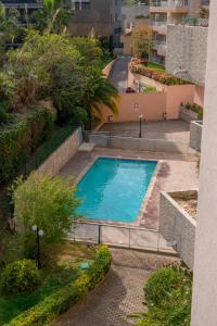 an overhead view of a swimming pool in a building at Appartement 4 pers à 50m de la plage, avec piscine in Roquebrune-Cap-Martin