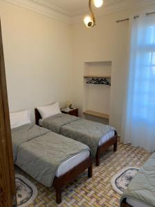 Postel nebo postele na pokoji v ubytování AFRIC HOTEL- Casbah