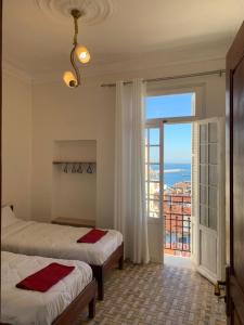 Postel nebo postele na pokoji v ubytování AFRIC HOTEL- Casbah