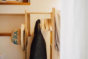 a closet with a black umbrella on a rack at Casa Merina in Trani