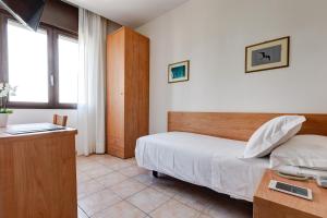 Postel nebo postele na pokoji v ubytování Hotel Piccadilly