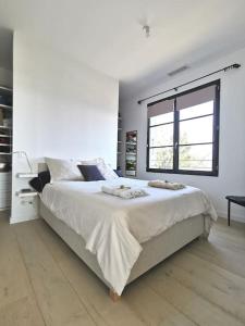 Voodi või voodid majutusasutuse Villa Turchina- vue imprenable à Erbalunga toas