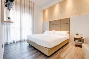 Postel nebo postele na pokoji v ubytování Hotel Piccadilly