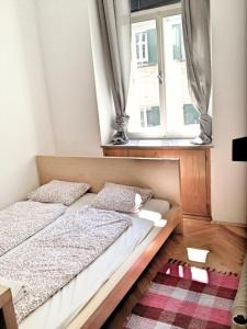Postel nebo postele na pokoji v ubytování Apartment Jakominiplatz
