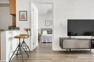 a living room with a television and a bedroom at N Hollywood 1BR w Pool Gym nr shops LAX-529 in Los Angeles