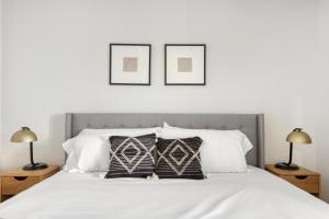 a bedroom with a white bed with two lamps at N Hollywood 1BR w Pool Gym nr shops LAX-529 in Los Angeles +25 photos