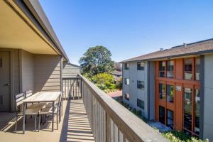 a balcony with a table and chairs and buildings at Foster City 2BR w Gym Pool WD nr highways SFO-567 in Foster City