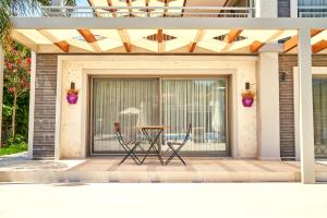 a patio with a table and two chairs on it at Vadi Boutique Hotel in Cesme