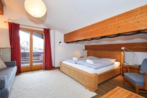 Llit o llits en una habitació de Ferienwohnung Breitschaft-Mühlberger