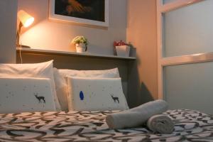 Katil atau katil-katil dalam bilik di Serenity Suites: Your tranquil gateway!