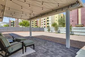 a pavilion with chairs and a table on a patio at Central Henderson Retreat Near Dining and Lake Mead! in Las Vegas
