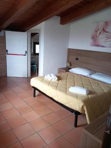 Postel nebo postele na pokoji v ubytování Agriturismo L'Ulivo