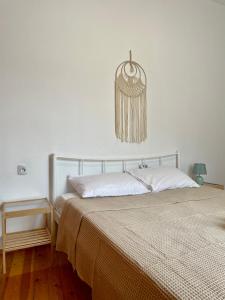 a bedroom with two beds and a chandelier at The balcony in Glossa