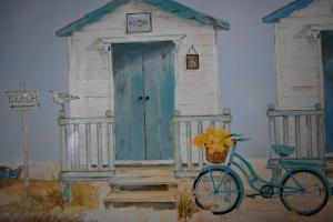 a painting of a house with a blue door and a bike at Apartment No. 8, 1 bed, sleeps 4 in Exmouth