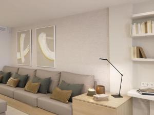 a living room with a couch and a table at Sitges Spaces Bonaire Beach, Near Everything in Sitges