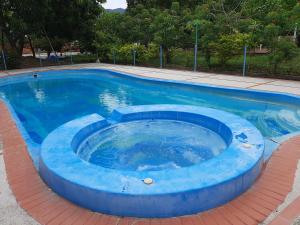Bazén v ubytovaní Hospedaje y eventos Quinta de las flores alebo v jeho blízkosti