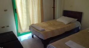 Cama ou camas em um quarto em Maldives Holtel