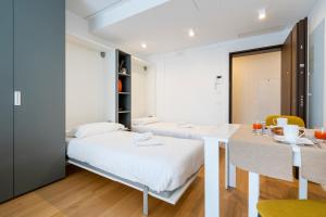 Letto o letti in una camera di Twelve12 - Università & Stazione Aparment