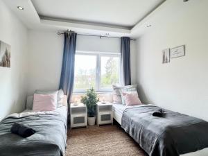 Cama o camas de una habitación en Helle, gemütliche Ferienwohnung in Bremerhaven