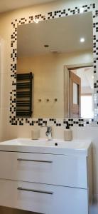a bathroom with a sink and a mirror at Horizon Lu Apartment by the Sea in Sopot +23 photos