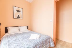 Posteľ alebo postele v izbe v ubytovaní Cosy F3 Lamartine 102 Coeur-Centre