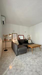 a living room with a couch and a coffee table at Casita Pepe in Jávea