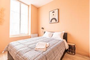 Posteľ alebo postele v izbe v ubytovaní Cosy F3 Lamartine 102 Coeur-Centre