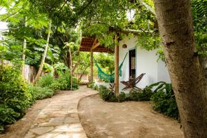 a house with a blue dragon on the side of it at Casa PROX AO MAR - Icaraizinho de Amontada in Amontada
