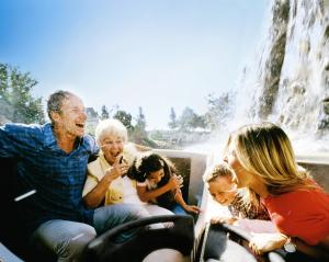 a group of people sitting in front of a waterfall at Natur-Resort Tripsdrill in Cleebronn