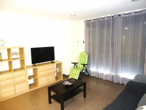 Televízia a/alebo spoločenská miestnosť v ubytovaní Edificio Papa Luna