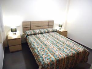 Posteľ alebo postele v izbe v ubytovaní Edificio Papa Luna