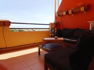 a living room with a couch and a table at La Terraza del Gallopedro in Vera