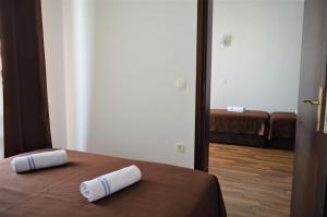 Llit o llits en una habitació de MS Hotel