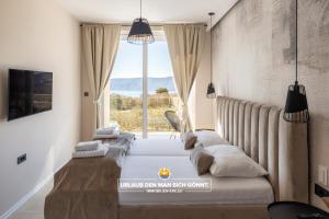 Posteľ alebo postele v izbe v ubytovaní Villa Neoma + 37 fotografií