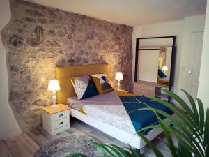 Posteľ alebo postele v izbe v ubytovaní Maison de village avec terrasse