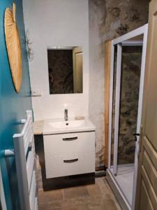 a bathroom with a sink and a shower at Maison de village avec terrasse in Luc-en-Diois