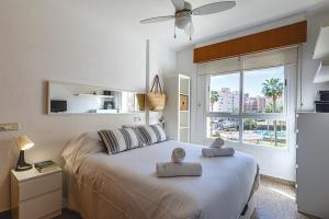 Posteľ alebo postele v izbe v ubytovaní Apartamento con piscina y parking - Playa San Juan