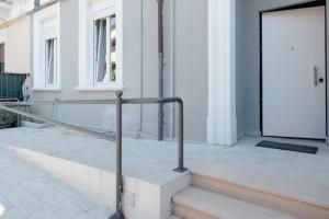a metal railing on the steps of a building at Tenuta Mastro in Sulmona +31 photos