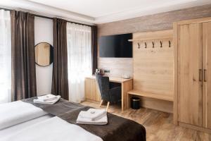 Letto o letti in una camera di Wellness Hotel Ondrášův dvůr